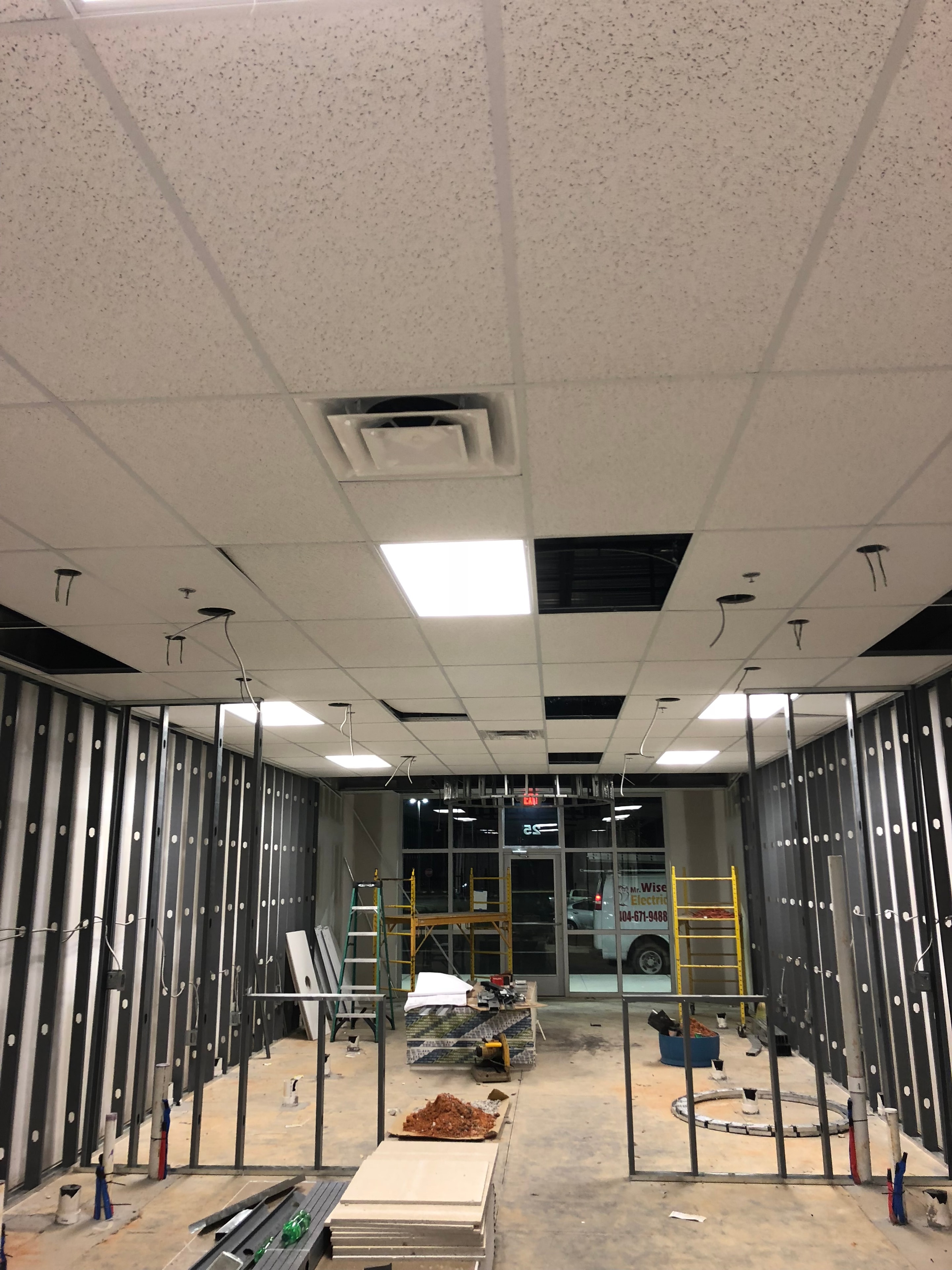 Commercial electrical rough-in with ceiling framing and recessed lighting installation
